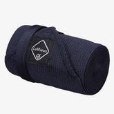 rolled up navy tail bandage with LeMieux branding on a grey background